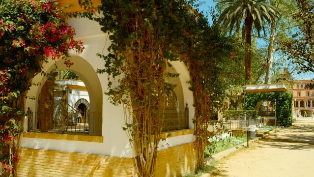The Parque de Maria Luisa, Seville, Spain, expansive lush park with gardens, fountains, monuments, and the impressive Plaza de Espana