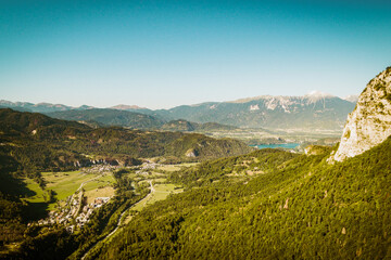 Fototapeta na wymiar Aerial panoramic view scenic greenery Slovenian mountains views. Road trip way through slovenian countryside to Bled and Bohinj lakes in Slovenia. Famous travel destination concept