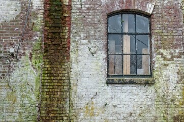 Stone weathered wall of historic old building