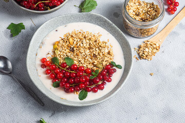 Oatmeal. Granola with yogurt and red currant

