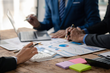 The sales department is having a monthly summary meeting to bring it to the department manager, they are verifying the correctness of the documents that are prepared before bringing in to the manager