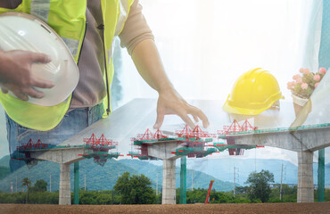Engineer supervising the construction of a concrete bridge.