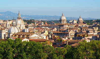 Fototapeta na wymiar Rome skyline, Italy, Europe. Scenic view of Rome buildings on mountains background