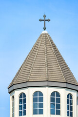Toronto, Canada, Dome or cupola in the St. Mary Armenian Apostolic Church. Exterior architecture with a Christian cross on top.