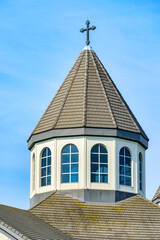 Toronto, Canada, Dome or cupola in the St. Mary Armenian Apostolic Church. Exterior architecture with a Christian cross on top.