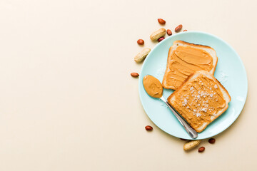 Peanut butter sandwiches or toasts on light table background.Breakfast. Vegetarian food. American cuisine top view vith copy space