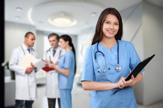 Young female doctor portrait with medical team on background, AI generated image