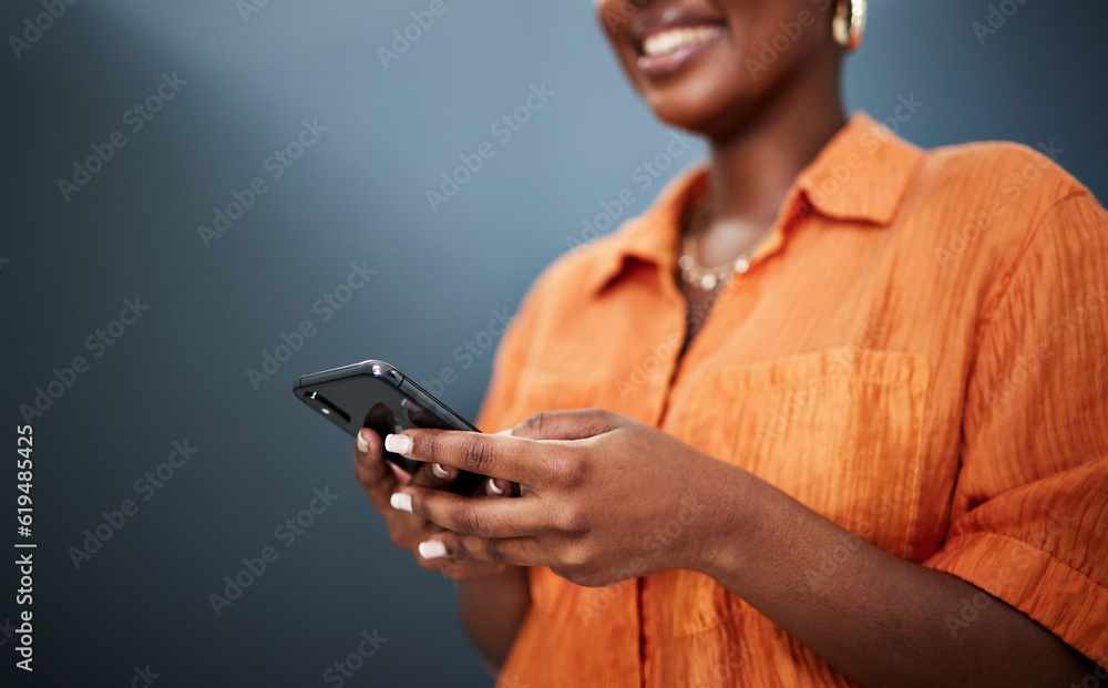 Poster typing, happy and hands with a phone on a dark background for communication or social media. smile, 