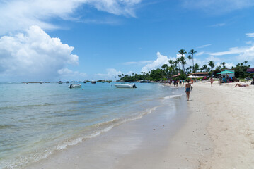 People tourists on the beach of Morro de Sao Paulo in the city of Cairu, Brazil.