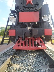 old steam train with a red star