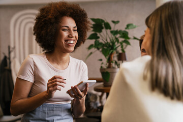 Waitress smiling while taking order in cafe