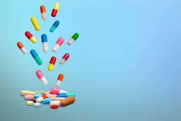 Falling colored medicine pills and capsules