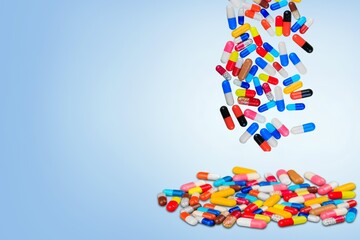 Falling colored medicine pills and capsules