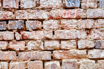 Dirty red brick wall background. Brick wall with stain texture, grunge background, interior design. Stonewall background.