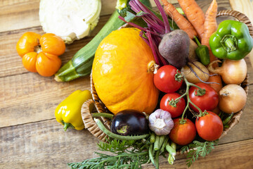 Big basket with different fresh farm vegetables. Vegetarian. Harvest. Healthy diet concept. Copy space.