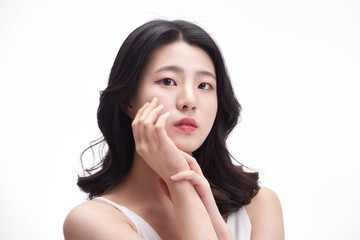 Fototapeta premium picture of a young girl with clean skin on a white background. Skin care and beauty.