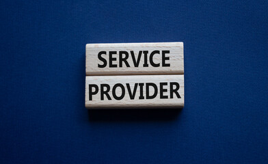 Service Provider symbol. Concept words Service Provider on wooden blocks. Beautiful deep blue background. Business and Service Provider concept. Copy space.