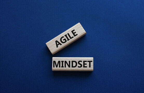 Agile Mindset symbol. Wooden blocks with words Agile MindsetAgile Mindset. Beautiful deep blue background. Business and Agile Mindset concept. Copy space.