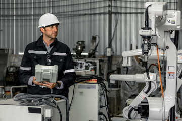 Experienced robotic technicians automate, set up, and give access for a welding process via a...