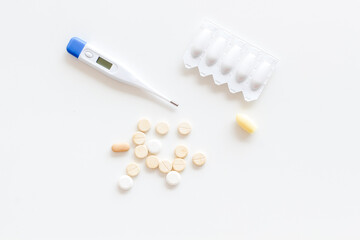 Medical treatment concept with thermometer pills and rectal suppositories