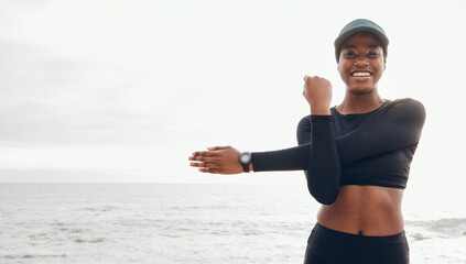 Portrait of woman stretching by ocean for fitness in nature for exercise, marathon training and running. Sports, mockup and African female person stretch arms for warm up, cardio workout and wellness
