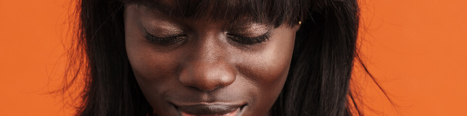 Obraz premium Young beautiful calm african woman with closed eyes praying