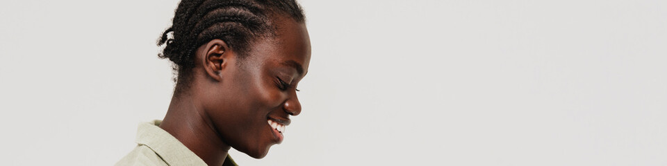 Young beautiful smiling happy african woman using phone