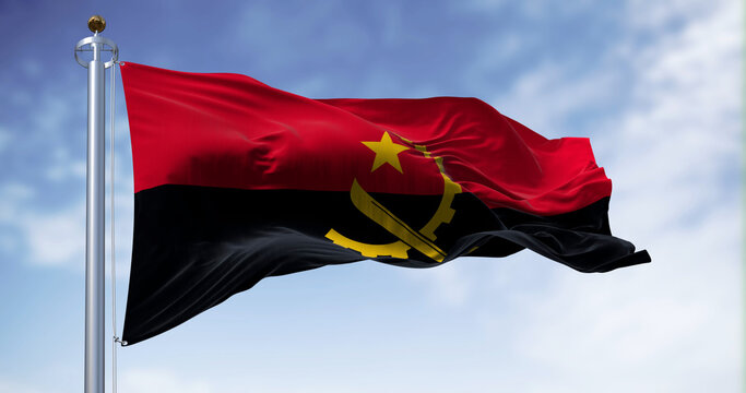 The national flag of Angola waving in the wind on a clear day