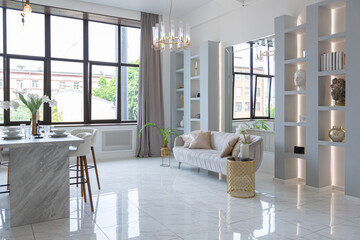 minimalistic light elegant luxury design of a modern spacious studio apartment with kitchen area,...