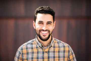 Happy handsome arab man looking at camera and smiling