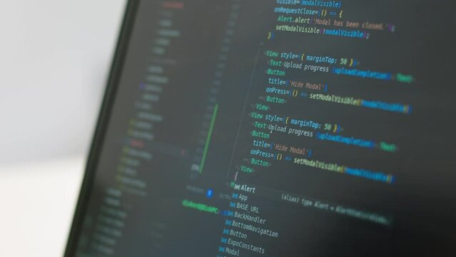 The programmer writes a program code, creating a program, on the screen, close