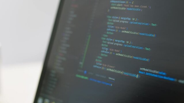 The programmer writes a program code, creating a program, on the screen, close