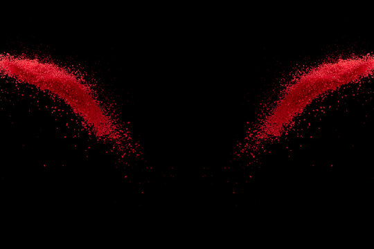 Red confetti sand falling and scatter on black space background   
