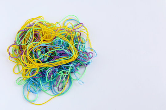 multi color tangled thread isolated on white background