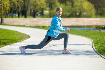 Woman exercising in the park and doing lunging