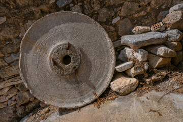 Old stone grain millstone in a Mani village in southern Peloponnese, Lakonia, Greece. 