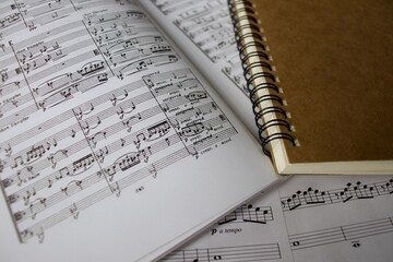 Music scores and brown spiral note book 