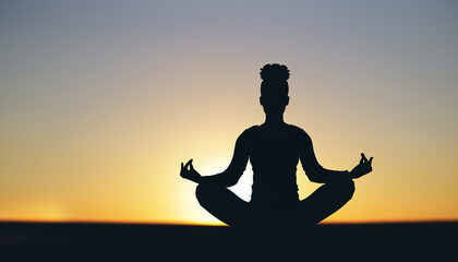 silhouette of a person in yoga pose on sunset