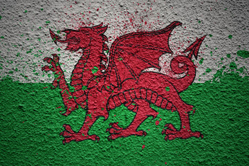 painted big national flag of wales on a massive old cracked wall