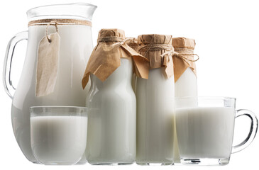 Fresh organic milk in glass and jug on rustic wooden table on nature background. - Powered by Adobe