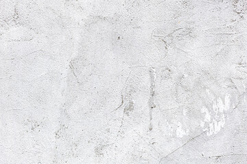 White Street Wall Texture Background. Painted Distressed Wall Surface. Grunge Background. Shabby Building Facade With Damaged Plaster. 