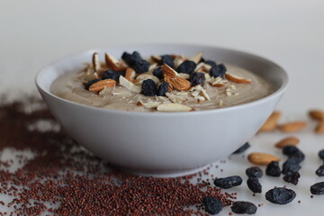 Ragi porridge. A porridge made of finger millet flour, sweetened with jaggery and served with sliced and crushed almonds and raisins