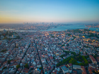 Obraz premium Nuruosmaniye Mosque and Sultanahmet aerial view with Golden Horn and Bosphorus Strait at sunset in city of Istanbul, Turkey. Historic Areas of Istanbul is a UNESCO World Heritage Site. 