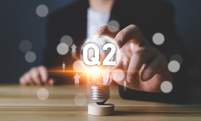 Business Profit growth, Financial report, Second quarter Concept. 2nd quarter positive growth performance report light bulb idea, increasing financial, Q2, stock, analysis, Business chart, success.