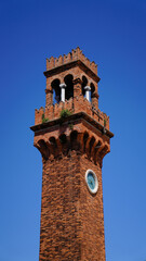 Fototapeta na wymiar bell tower of the church of sestieri sunset, Venice, Italy