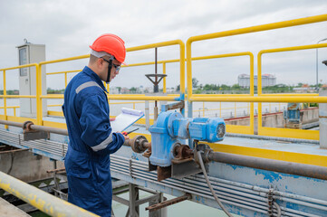 Water plant maintenance technicians, mechanical engineers check the control system at the water treatment plant.