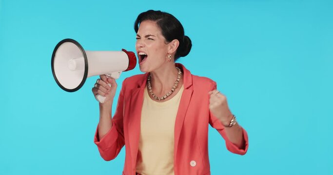 Studio, shouting or woman with megaphone for speech, protest or activism for human rights or equality. Blue background, loudspeaker broadcast or angry person with voice or mic for change or justice