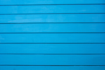 Obraz premium blue background made of painted wooden boards. High quality photo