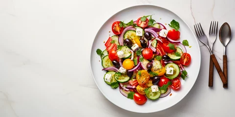 Poster Close - up, hyper - realistic image of a vibrant, freshly prepared Greek salad with a shining silver fork, served on a white ceramic plate © Marco Attano