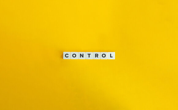 Control Word on Block Letter Tiles on Yellow Background. Minimal Aesthetic.